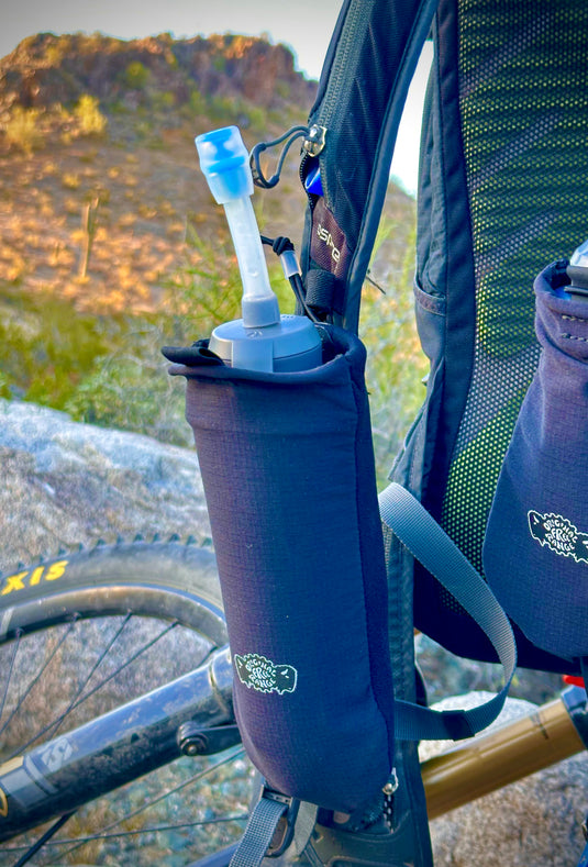 Add-on flask pockets for backpacks.