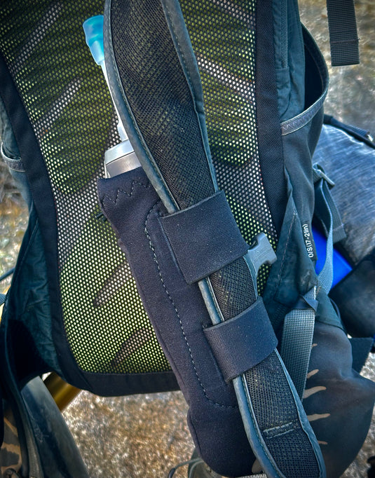 Add-on flask pockets for backpacks.