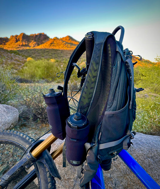 Add-on flask pockets for backpacks.