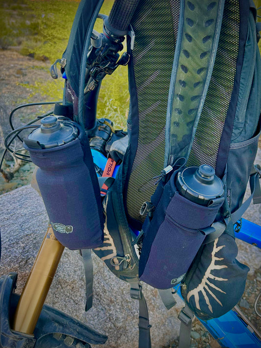 Add-on water bottle pockets for backpacks.