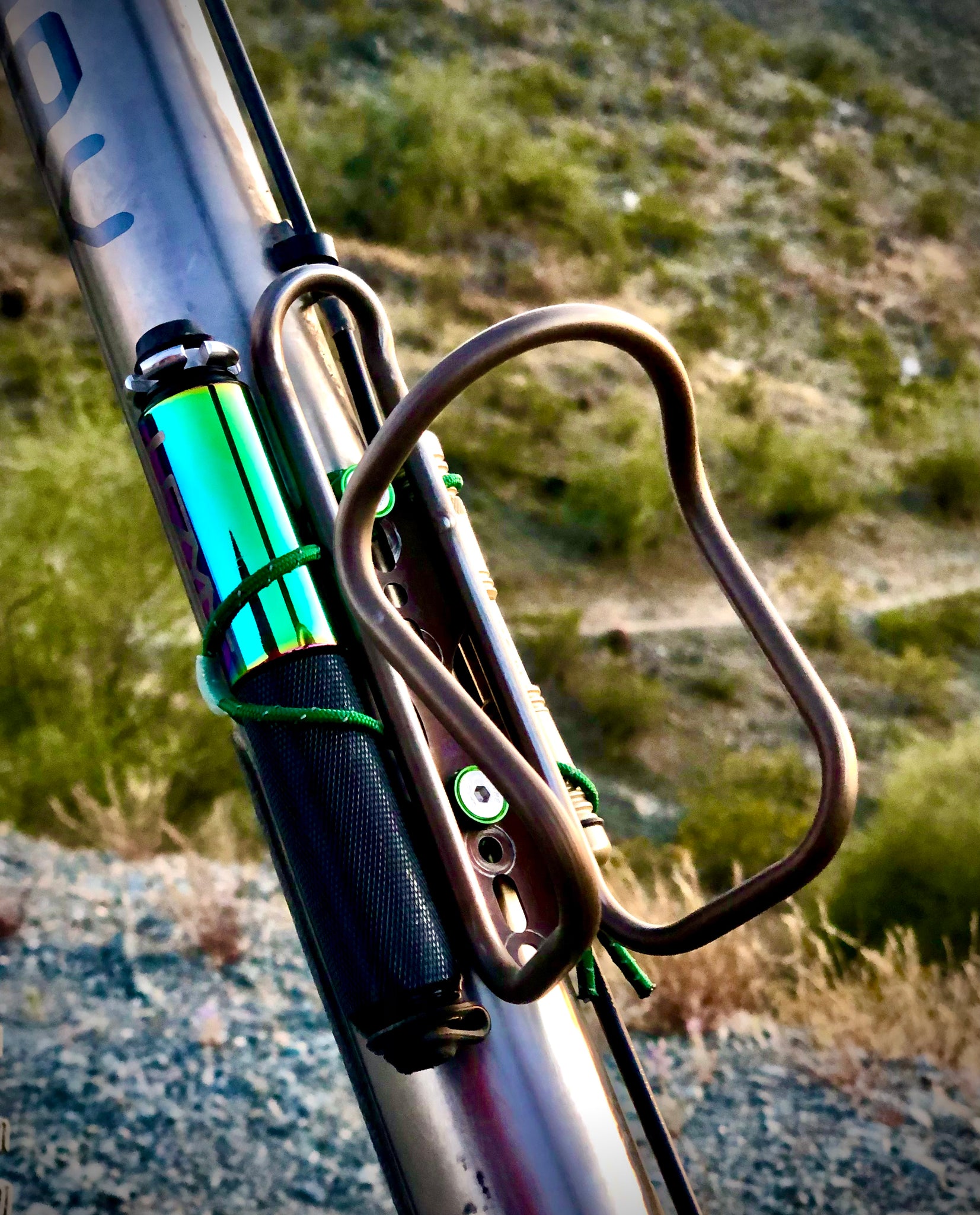 Water bottle cage with pump outlet mount